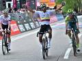 Jhonatan Narvaez (c) celebrates after crossing the finish line to win the first stage of the Giro. (EPA PHOTO)