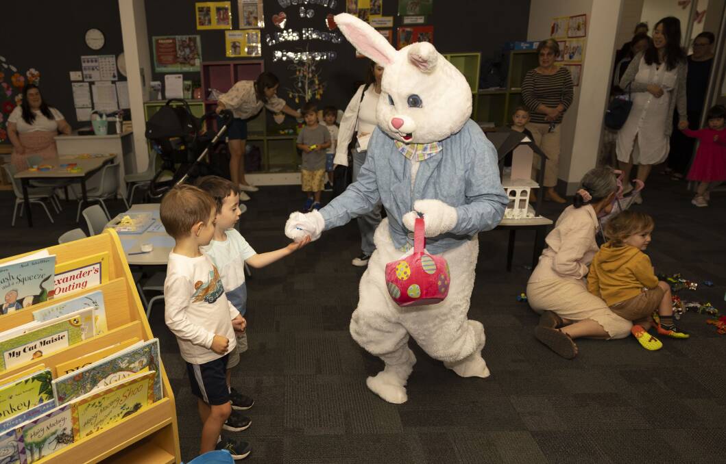 The principal of Sacred Heart Primary School in Pearce, David Austin, dressed up as the Easter Bunny to entertain the playgroup kids.