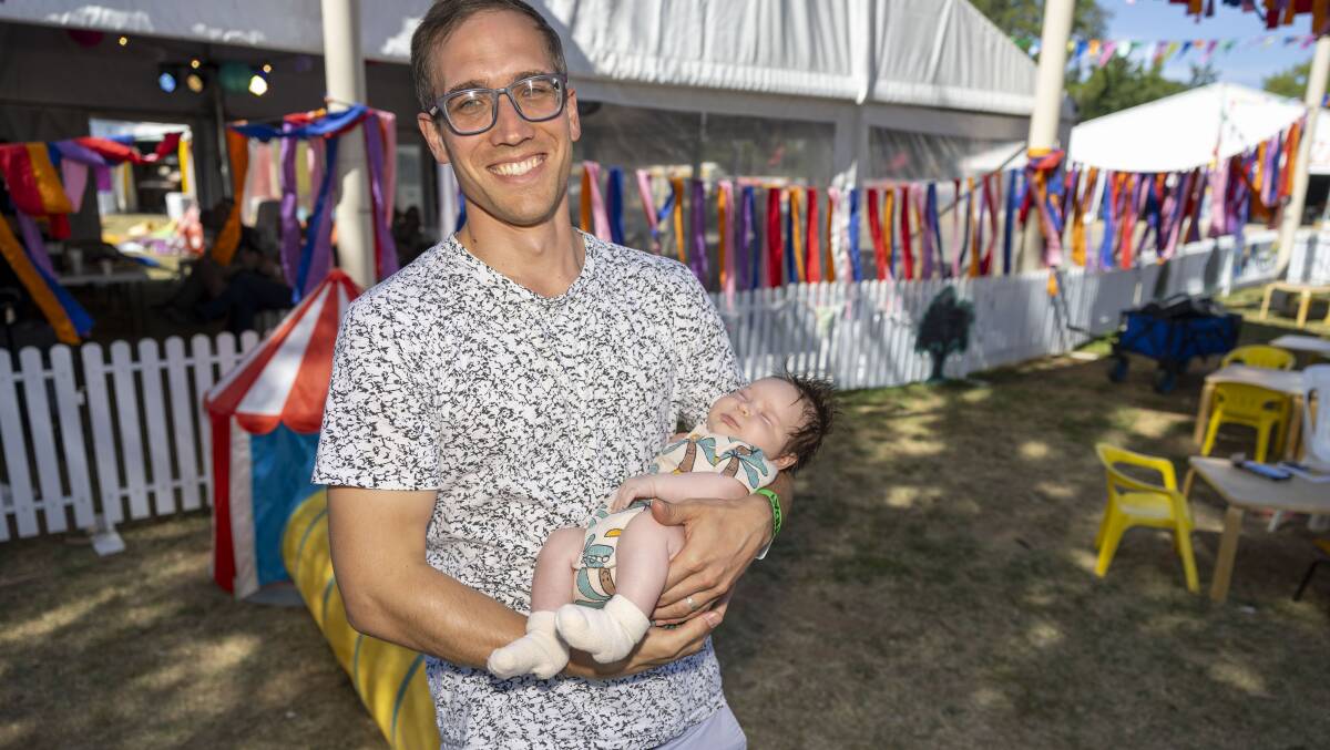 Andy Bachelr with his six-week-old daughter Aurelia enjoying the festival