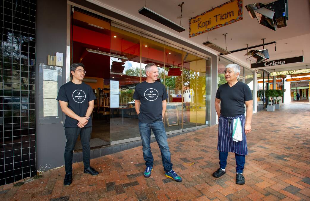 Alistair Ong (left) with his dad Abell Ong (right) at their restaurant Abell's Kopi Tiam in Manuka, with Canberra Eats founder Chris Hansen (middle). Picture: Elesa Kurtz