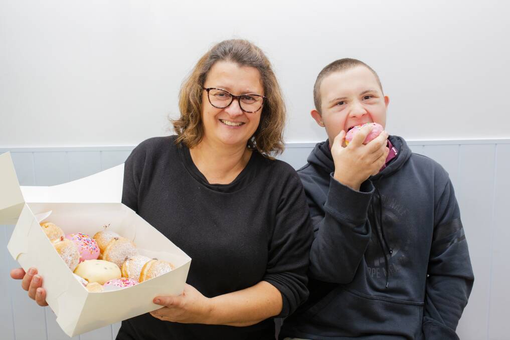 Krofne owner Danijela Vrkic with son Anthony, who works for the social enterprise, on Tuesday as they prepare for online ordering. Picture: Jamila Toderas.