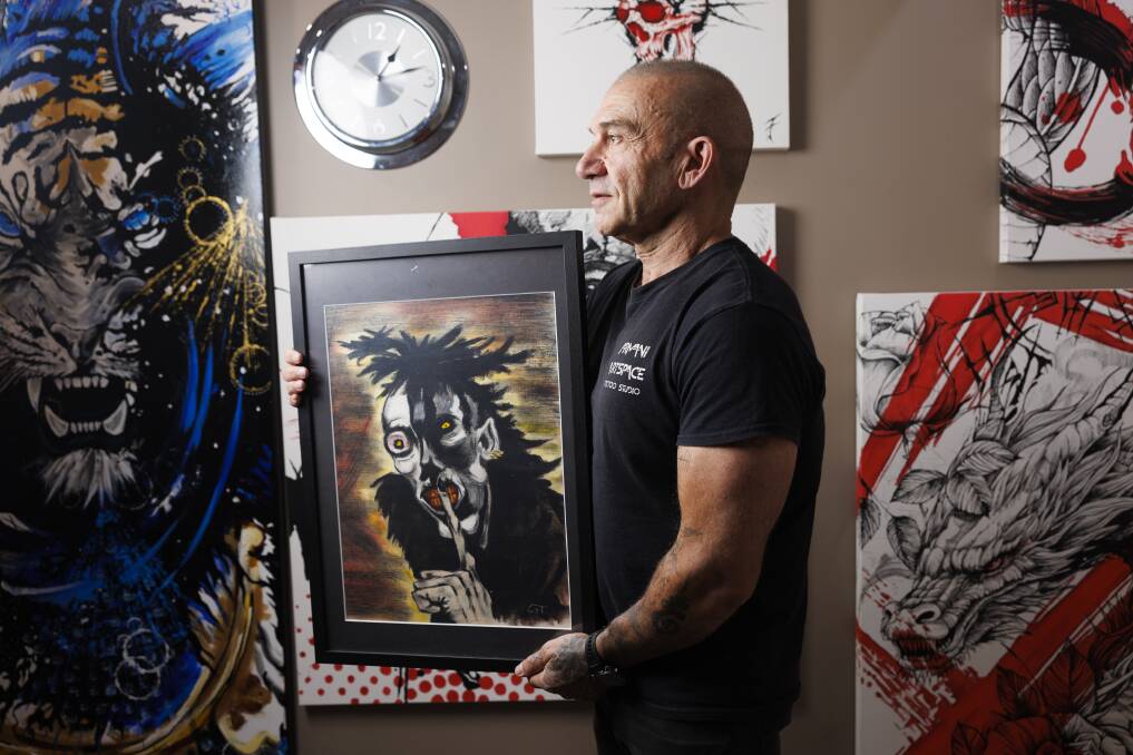 Tattoo artist George Theodosiou, with some of his works. Picture by Keegan Carroll