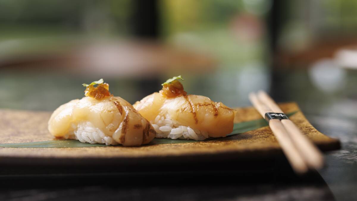Hokkaido scallop nigiri with almond honey and lemon burm. Picture by Keegan Carroll