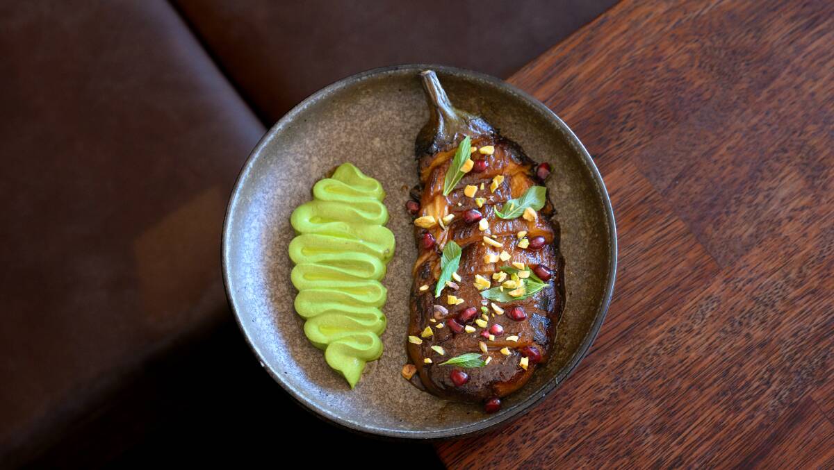 Wood-fired eggplant, pistachio cream, pomegranate. Picture by Sitthixay Ditthavong