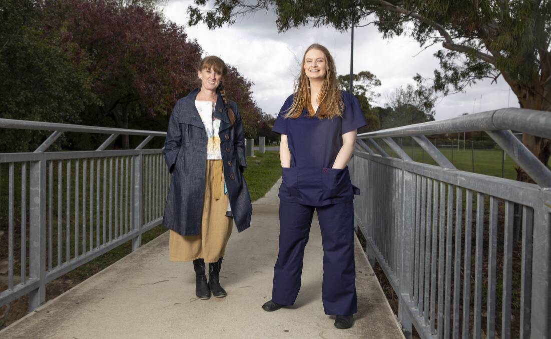 Pure Pod deisgner Kelli Donovan, left, has started making scrubs for doctors in need, as worn by Adopt A Healthcare Worker Canberra's Jimilla Hogan. Picture: Sitthixay Ditthavong