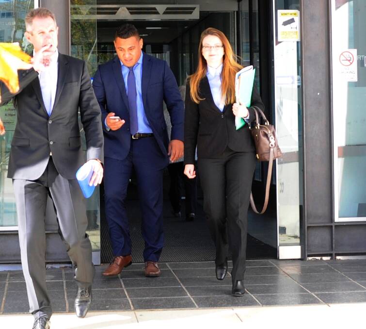 Axed: Canberra Raider Josh Papalii, centre, leaving the ACT Magistrates Court before his sacking from the Kangaroos. Photo: Megan Gorrey