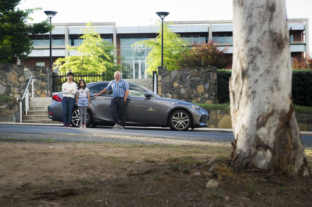 Maggie, Nina, 10, and Peter Pharaoh were fined $270 for parking in the middle of Melbourne Avenue with scores of other cars for the Canberra Girls Grammar Fete last month.  Photo: Elesa Kurtz