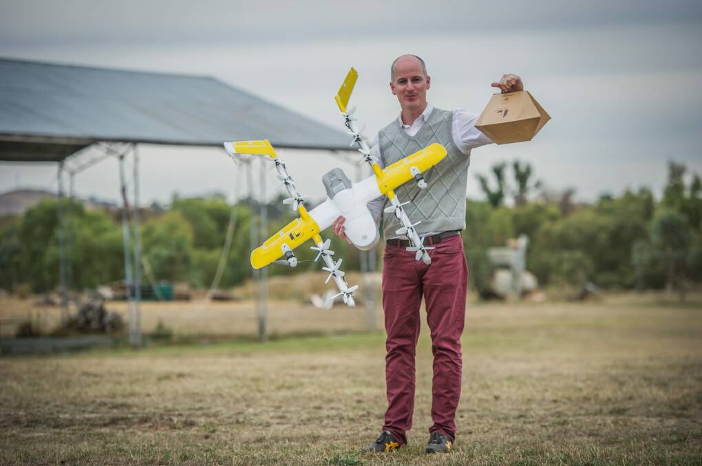 Wing has been developing a drone delivery service for Tuggeranong. Delivery project manager Luke Barrington shows the aircraft and package involved. Photo: Karleen Minney