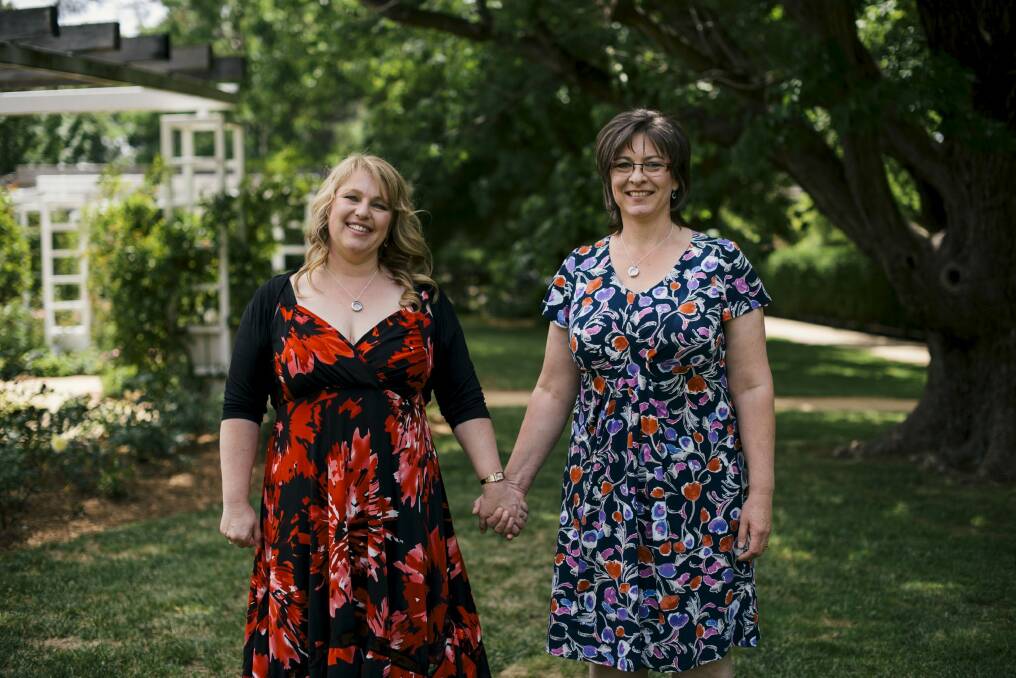 Glenda and Jennifer Lloyd after their wedding ceremony at the Old Parliament House rose gardens last year. Photo: Rohan Thomson
