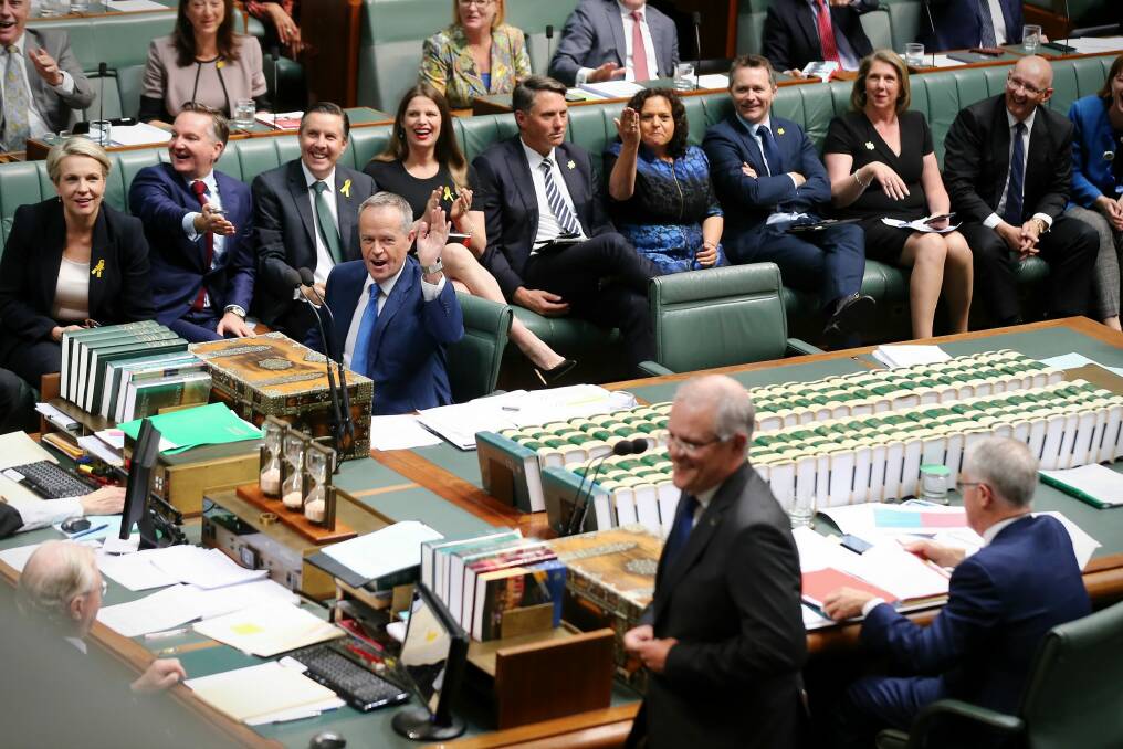 Opposition Leader Bill Shorten and his frontbench react to Treasurer Scott Morrison and Prime Minister Malcolm Turnbull during question time. Photo: Alex Ellinghausen
