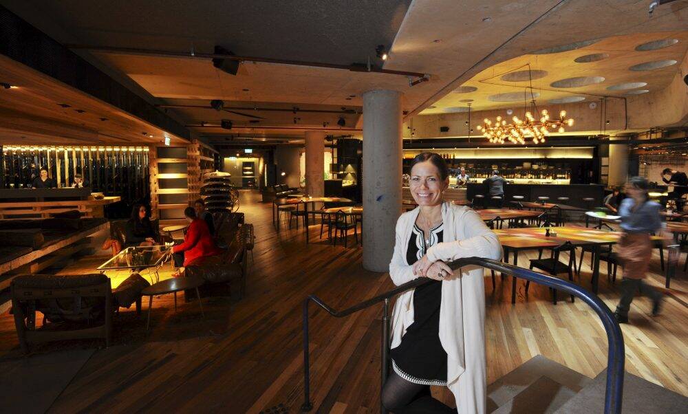  Hotel Hotel, General Manager, Tracy Atherton in the hotel's reception and bar. The establishment in the Nishi building, New Acton, has won a Gourmet Traveller award for best boutique hotel. Photo: Graham Tidy