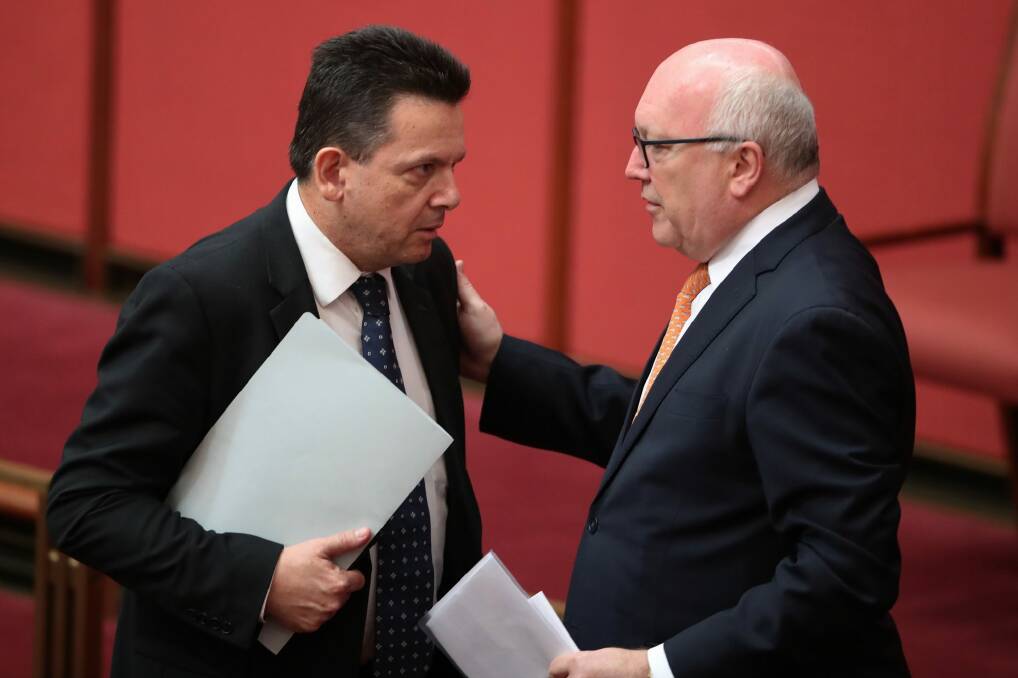 Senator Nick Xenophon with Attorney-General Senator George Brandis in the Sentate on Friday.  Photo: Andrew Meares