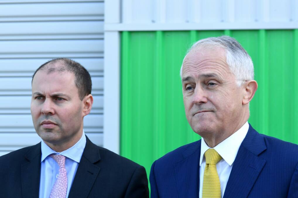 Prime Minister Malcolm Turnbull (right) and Energy Minister Josh Frydenberg are trying to ramp up pressure on the states to support the national energy guarantee. Photo: AAP
