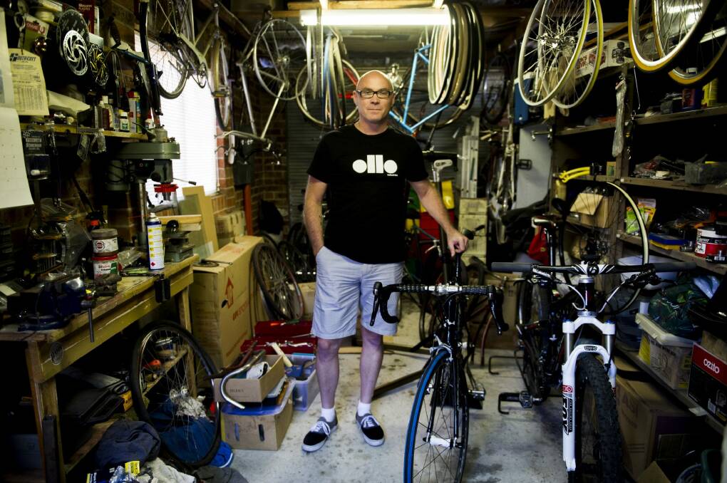 Neil Buttriss, of Gordon, in his garage at home with his bikes and equipment. He has almost completely recovered from injuries he received when he was knocked off his bike by a kangaroo. Photo: Jay Cronan