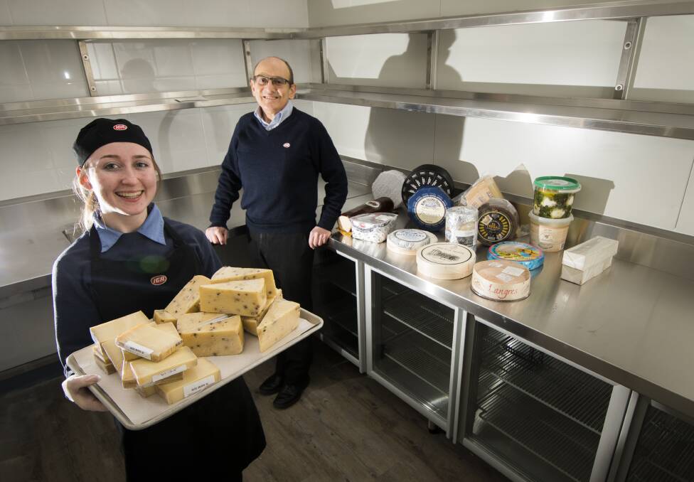 Sapphira Nix cheese and deli staff member with Ainslie IGA manager Manuel Xyrakis in the specially created cheese room as they advertise for a cheese manager. Photo: Elesa Kurtz