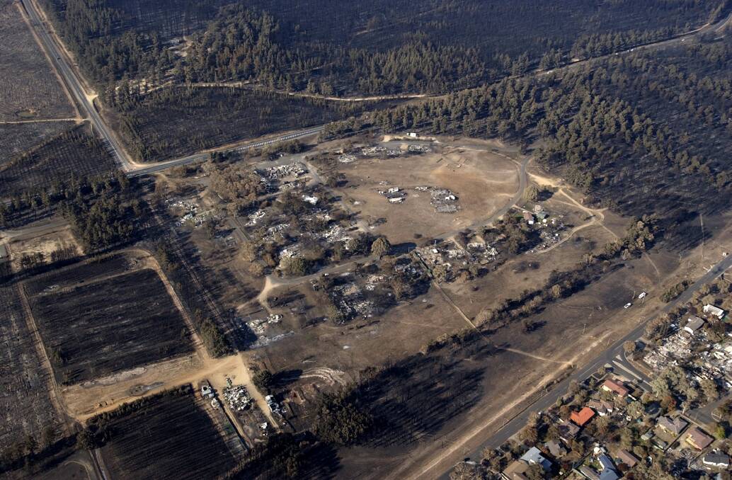 The Stromlo settlement, and the outskirts of Duffy after the fire on January 28, 2003.  Photo: Graham Tidy