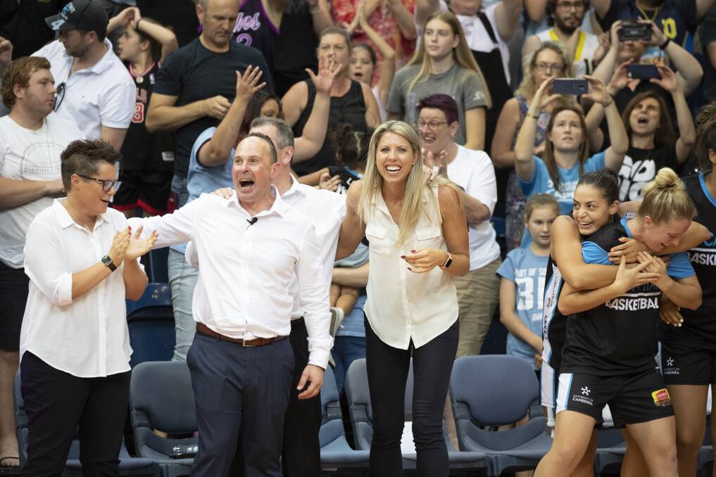 Canberra Capitals coaches and bench players rejoice. Photo: Sitthixay Ditthavong