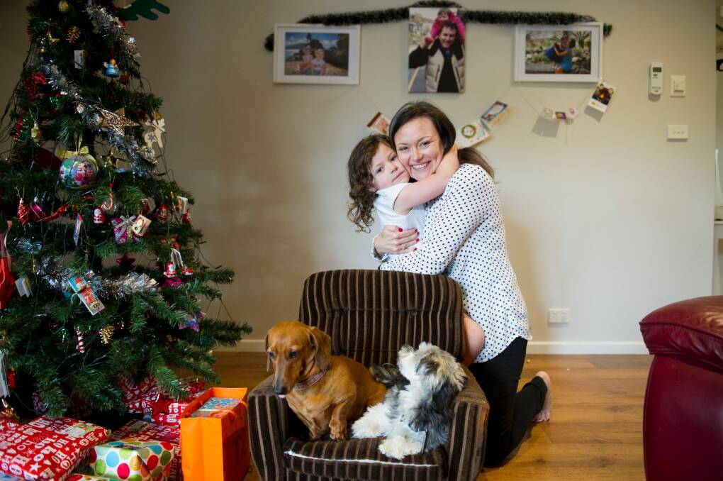Jocelyn Williams with her daughter Elke, then aged four, pictured last year at home in Canberra. Mrs Williams continues to help fundraise in memory of her late husband Michael. Photo: Jay Cronan