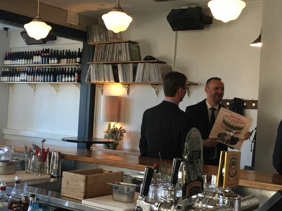 Chief Minister Andrew Barr with Attorney-General Gordon Ramsay and Bar Rochford on Monday, where Mr Barr spots a favourite album, the Rolling Stones' Let It Bleed from 1969. Photo: Kirsten Lawson