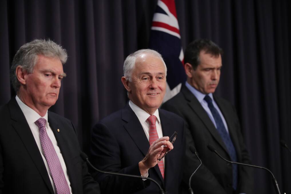 Former prime minister Malcolm Turnbull with ASIO Director-General Duncan Lewis and counter terrorism co-ordinator Tony Sheehan at Parliament House in 2017.   Photo: Andrew Meares 