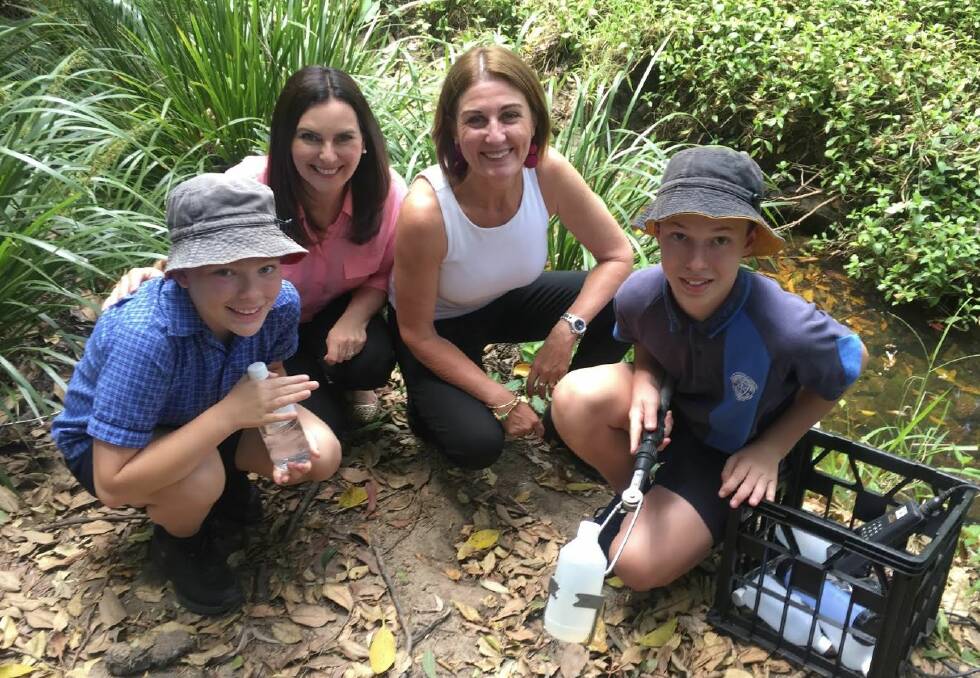 A 12 month revegetation project at Hilder Road state school at The Gap has improved dissolved oxygen.  (From left) Year 6 co-environmental captain Lillian Lambert, Michelle Cull from Queensland Urban Utilities, Julie McLellan from Healthy Land and Water and co-captain Thomas Craik.  Photo: Tony Moore