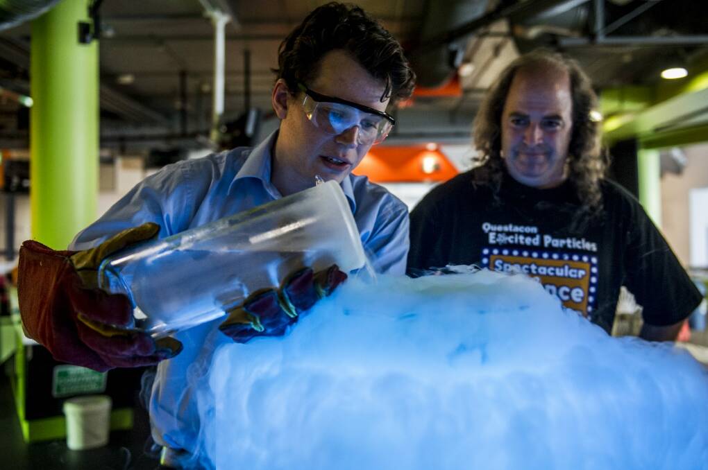 Excited Particles' Michael Bennett and Patrick Helean explore the physics of beer at Questacon.  Photo: Jay Cronan 