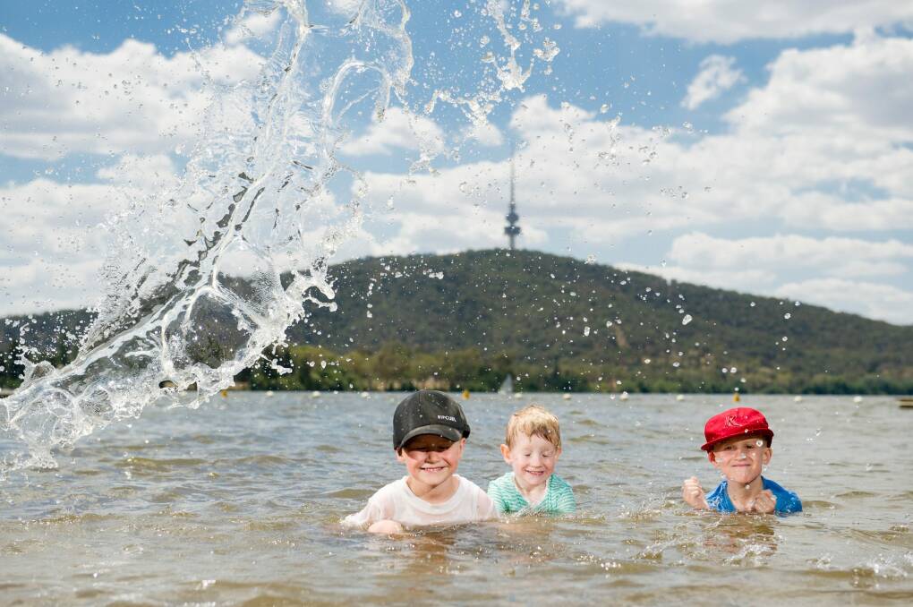 Fyn 4, Marlow, 3, and Noah Butler, 6, beating the heat in Lake Burley Griffin before the school holidays end. Photo: Jay Cronan