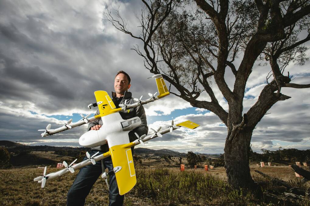 Wing chief executive James Ryan Burgess, pictured above, with one of the household delivery drones Photo: Sitthixay Ditthavong
