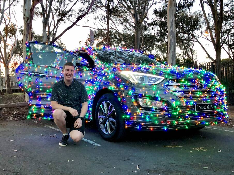 Jordan Wallace and the Christmas Car.  Photo: Supplied