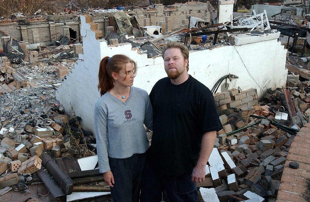 Jane and Owen Kenyon, at their destroyed Duffy home on January 28, 2003. Photo: Martin Jones