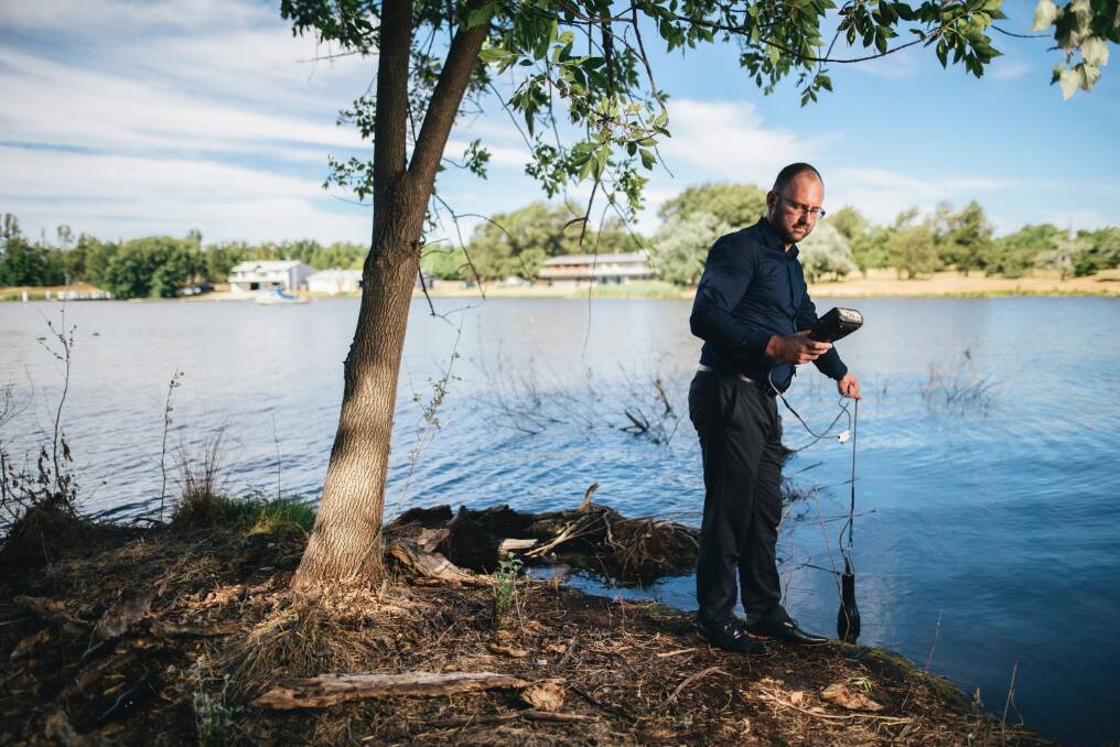 University of Canberra professor Ross Thompson testing water quality at Lake Burley Griffin. Photo: Rohan Thomson