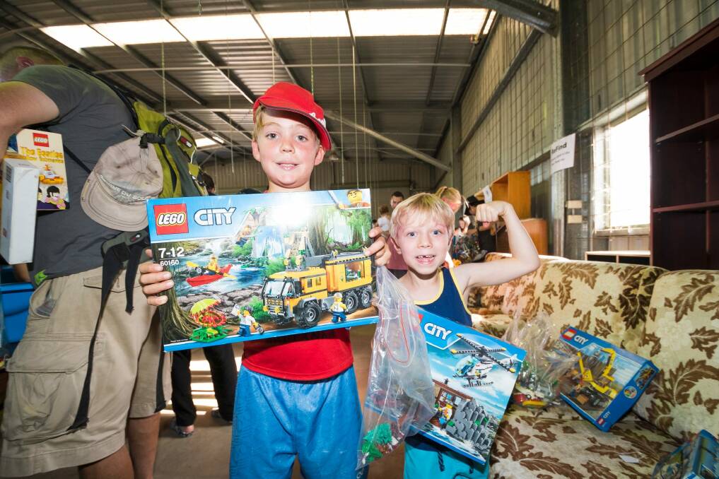 Aden Whiles and Tomek Dunski couldn't be more excited with their new lego toys. Photo: Dion Georgopoulos Photo: Dion Georgopoulos