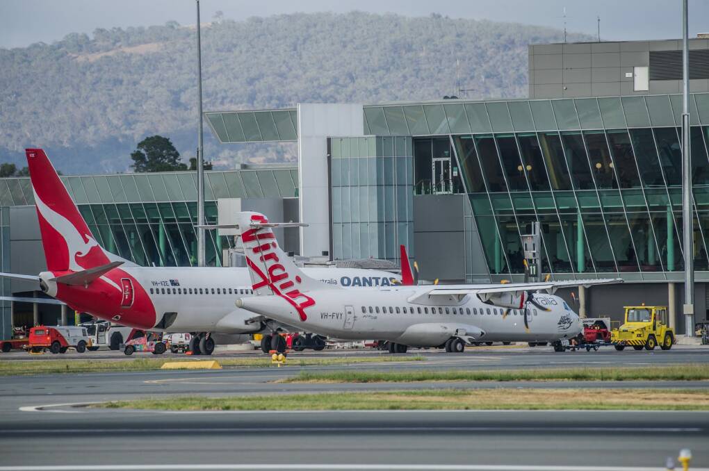 Qantas and Virgin aircraft at Canberra International Airport. ACT Chief Minister Andrew Barr says he wants to see direct flights between Canberra and Hobart. Photo: Karleen Minney