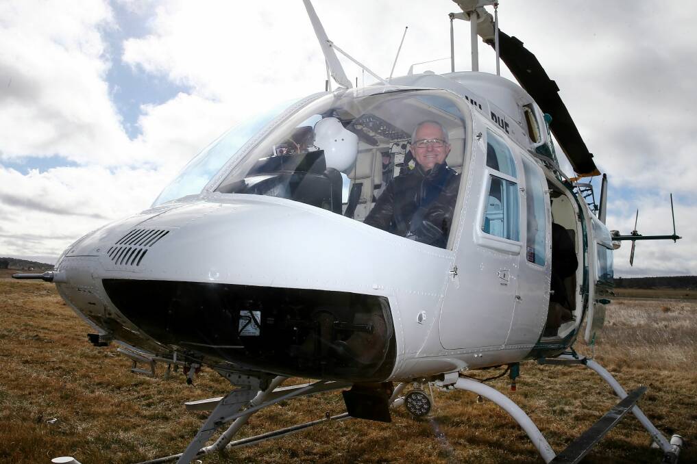 Prime Minister Malcolm Turnbull boards a helicopter tour for an aerial view of the region. Photo: Alex Ellinghausen