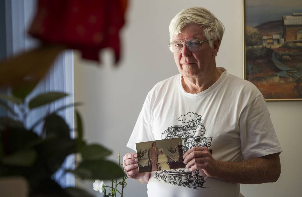 Eddy Mol, with picture of his late wife, Ruth on their wedding day, is concerned that the ashes of his baby son, who died in the 1970s, are missing from the Norwood Park memorial gardens. Photo: Elesa Kurtz