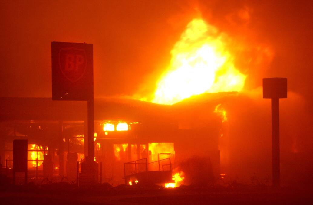 The BP servo in Duffy up in flames on January 18, 2003. Photo: Andrew Campbell