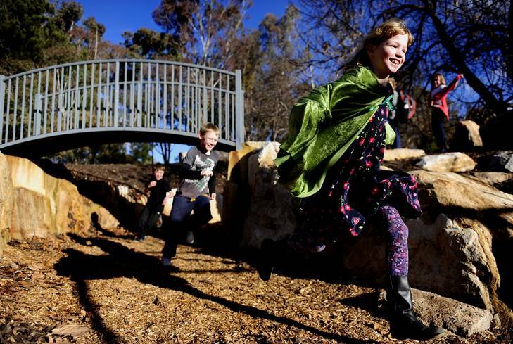 Blue Gum Community school has opened their refurbished campus. Playing in the rock area are Ruby Martyn, 8, of Ainslie, Jarod Pullen, 10, of Latham, and Samuel Inglis, 9, of Hackett . Photo: Melissa Adams