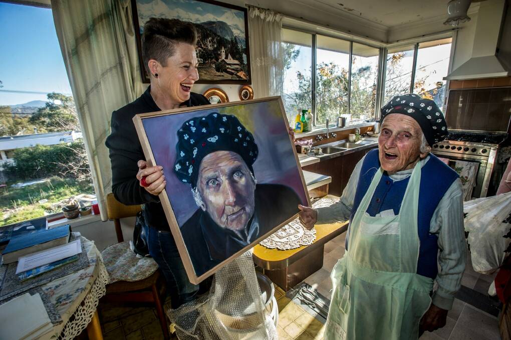 After 30 hours of painting, Jenny Blake hands over the portrait to "the truly inspirational" Stasia Dabrowksi. Photo: Karleen Minney