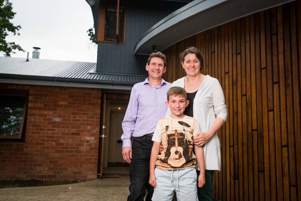 Michael Dobbie and Ruth Arkell, with daughter Sophia have recycled  their old home by maximising the amount of material reused from their old house.  Photo: Dion Georgopoulos
