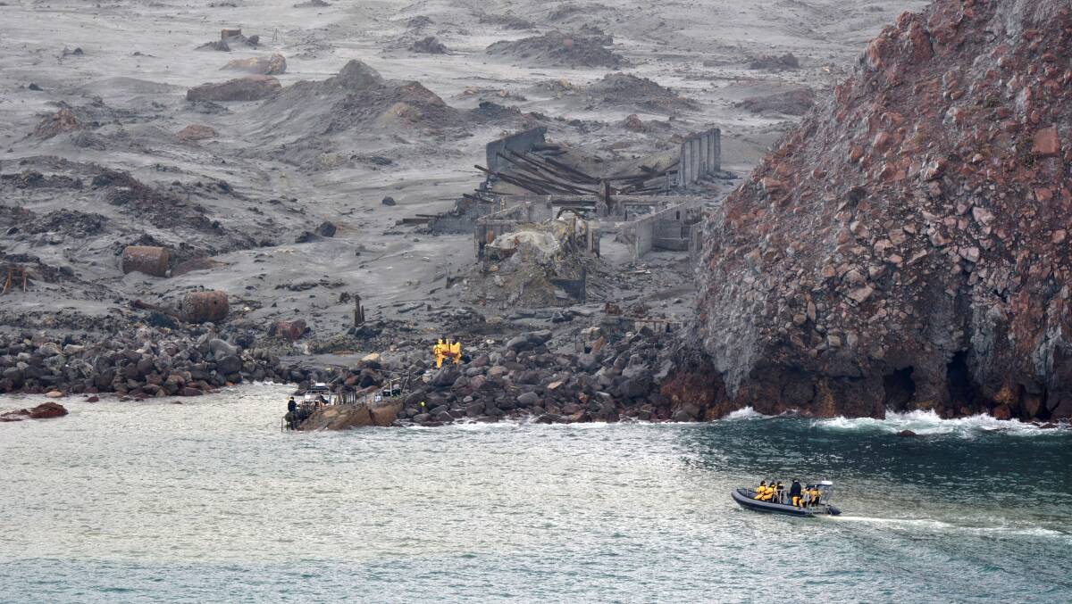 Members of the New Zealand Defence Force take part in a recovery operation to remove bodies from White Island on Friday. Picture: Getty Images