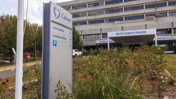 Signs have started to change at North Canberra Hospital but signs of the old Calvary remain. Picture by Keegan Carroll 