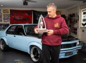 Jason Sandner with the Ring brothers' trophy from the Motorex show in Melbourne. Picture by Elesa Kurtz