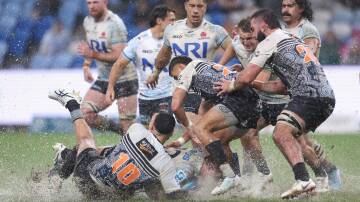 The rain flooded the playing surface in Sydney. Picture Getty Images