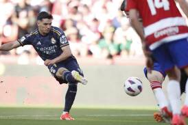 Real Madrid's Brahim Diaz scoring the first of his two goals in their 4-0 stroll against Granada. (AP PHOTO)