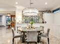 A Hughes home with a "wine library" in the dining room has set a suburb record. Picture supplied