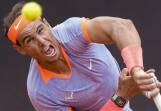 Rafael Nadal serves in his hard-fought victory over Belgium's Zizou Bergs at the Italian Open. (AP PHOTO)