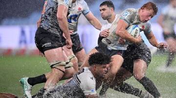 The Brumbies have got the better of the Waratahs, and the conditions, to all-but-book a home final. (Dan Himbrechts/AAP PHOTOS)