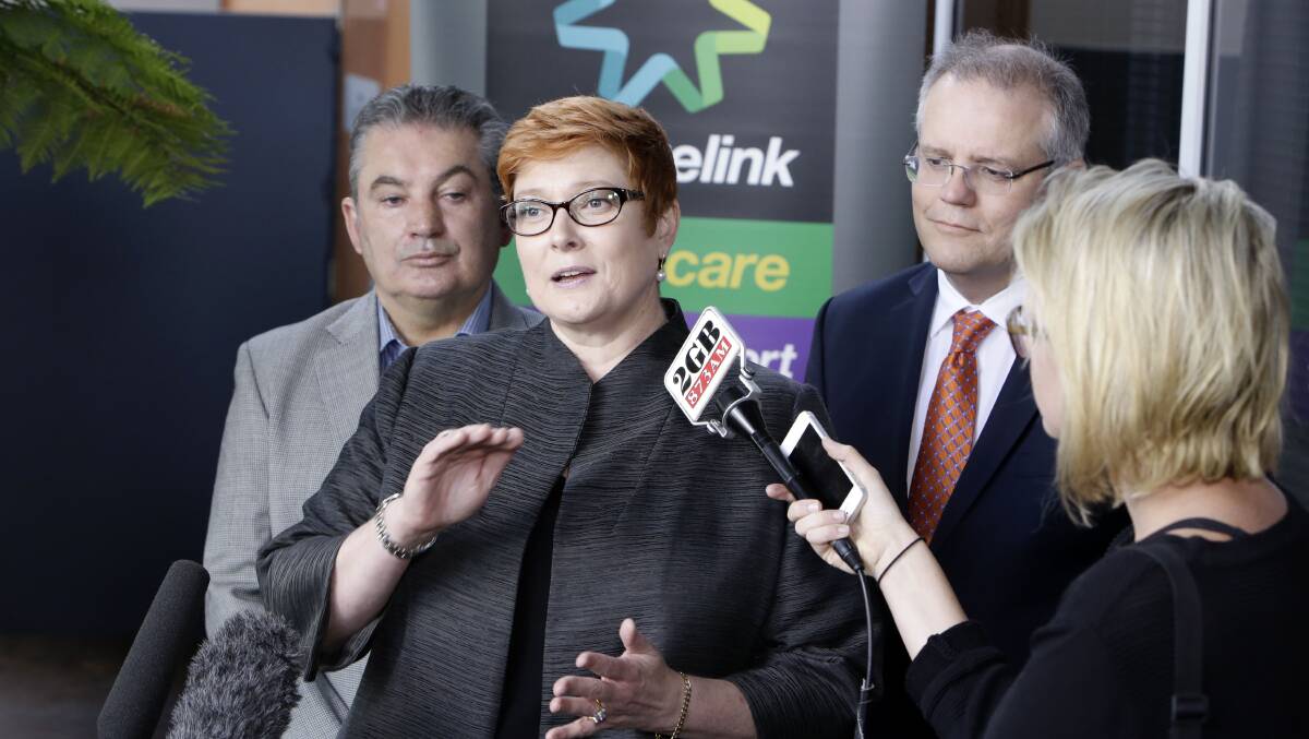 Former ministers Scott Morrison and Marise Payne at a Centrelink in Campbelltown in 2015. Picture by Anna Warr