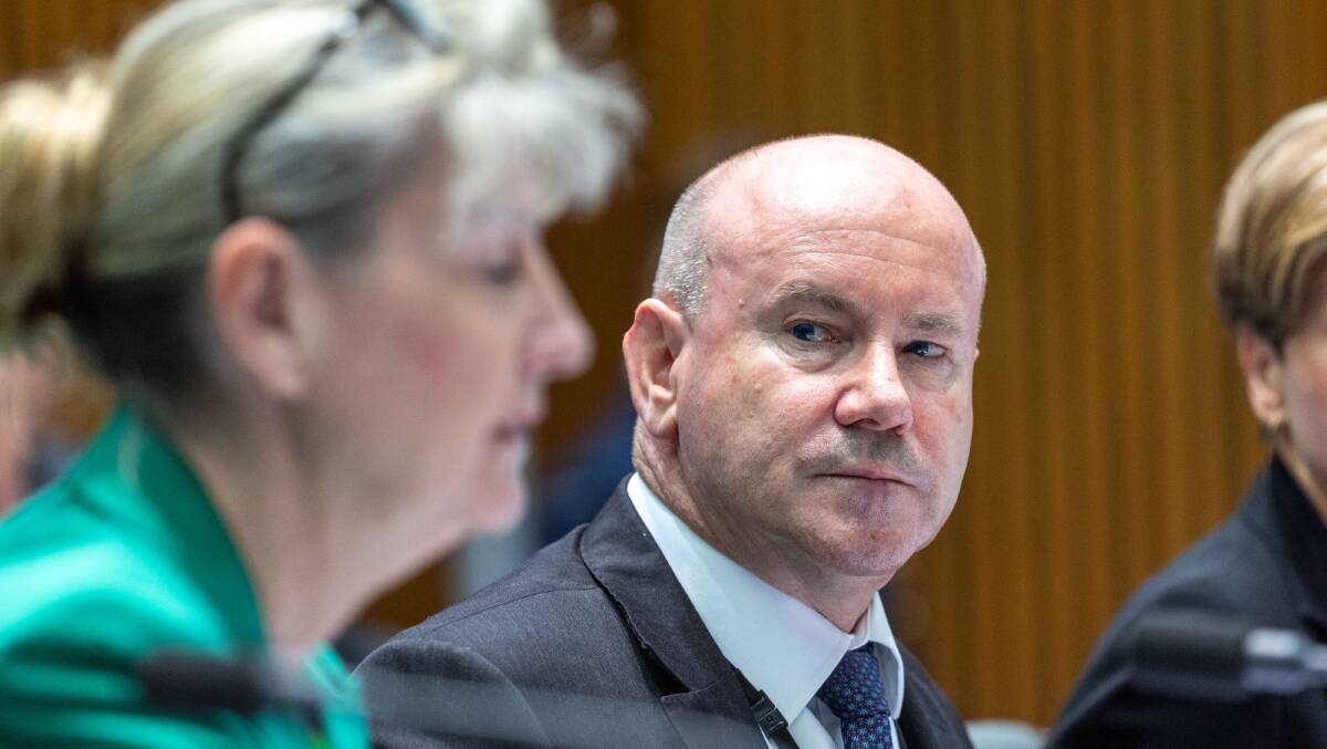 Department of Defence secretary Greg Moriarty looks to deputy secretary Justine Greig during a Senate estimates hearing. Picture by Gary Ramage