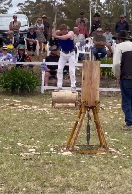Axeman Lane Chant competes in the wood chopping competition at Pambula Show 2023. 